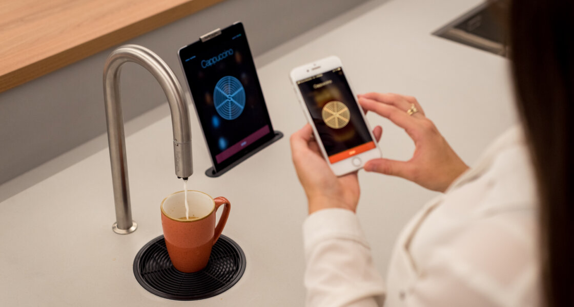 Employee using the TopBrewer app at the DLA Piper Perth staff hub