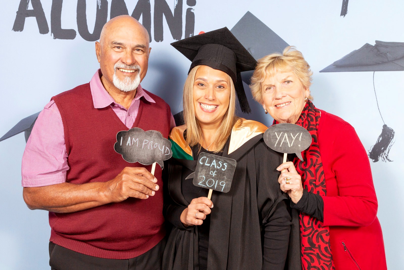 Celebrating her Executive MBA Graduation with her parents